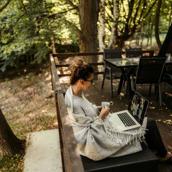 Woman at a campground using the Internet WiFi service to stream videos.