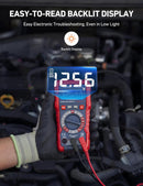 AstroAI Multimeter with digital display held by a person wearing gloves, used for electronic troubleshooting.