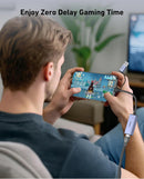 Person playing a game on a smartphone with a USB adapter, text 'Enjoy Zero Delay Gaming Time' above.