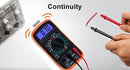 LJPXHHU A multimeter with an orange and black body is shown on a white surface, with a hand holding red and black test leads nearby. The word 'Continuity' appears above, along with small orange sound-wave graphics and the word 'buzz' near the display.