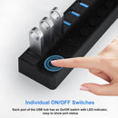 USB hub with individual ON/OFF switches and LED indicators, showing a hand pressing one of the switches.