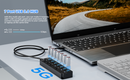 A 7-port USB 3.0 HUB with 5Gbps speed labels, shown connected to a laptop on a desk.