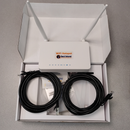 A white GIS-K1 WiFi hotspot router with two antennas displayed inside its open retail box, alongside two coiled black Ethernet cables and small accessories on a gray surface.